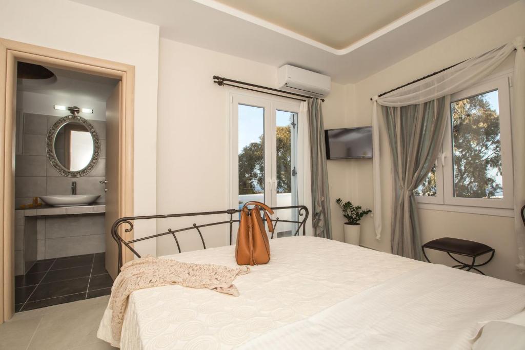 Postel nebo postele na pokoji v ubytování Pithos Apartments