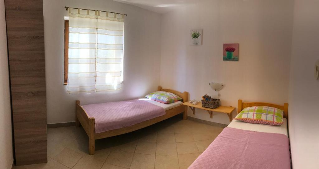 Apartments Di Gallo tesisinde bir odada yatak veya yataklar