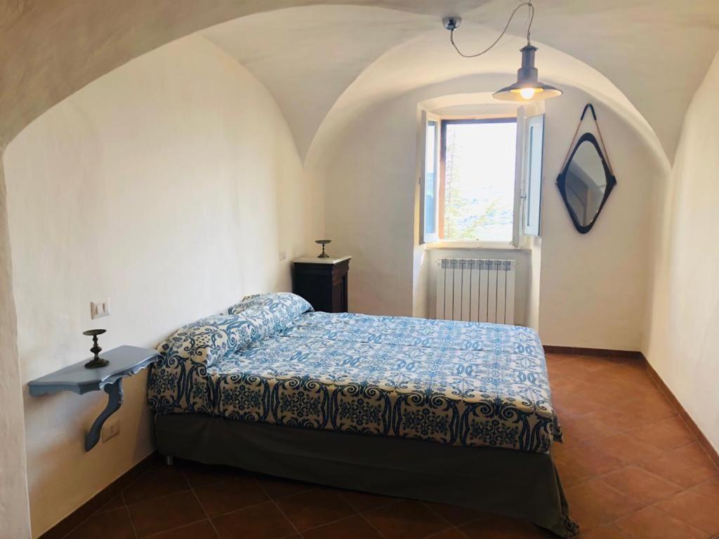 a bedroom with a bed and a window at La Casa Di Matilde-Centre of Todi in Todi