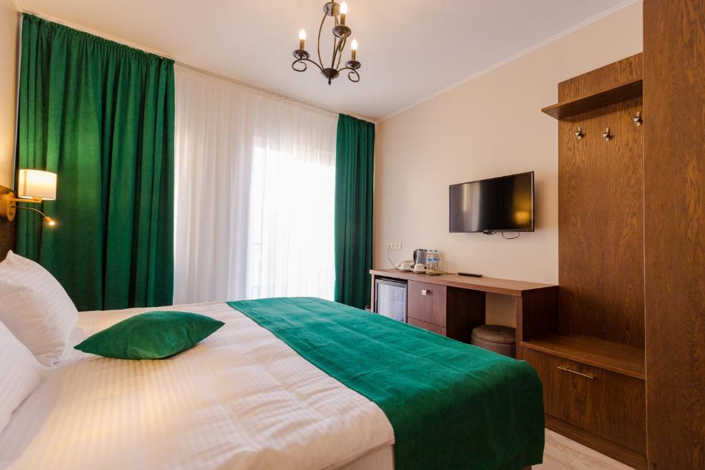 Postel nebo postele na pokoji v ubytování Hotel BLOOM Batumi
