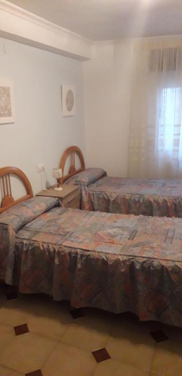 Postel nebo postele na pokoji v ubytování Casa Rosalia