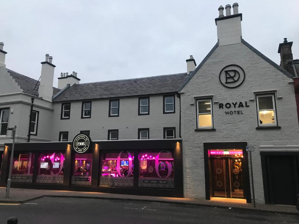 a store front with a window and a building at Royal Hotel in Cumnock