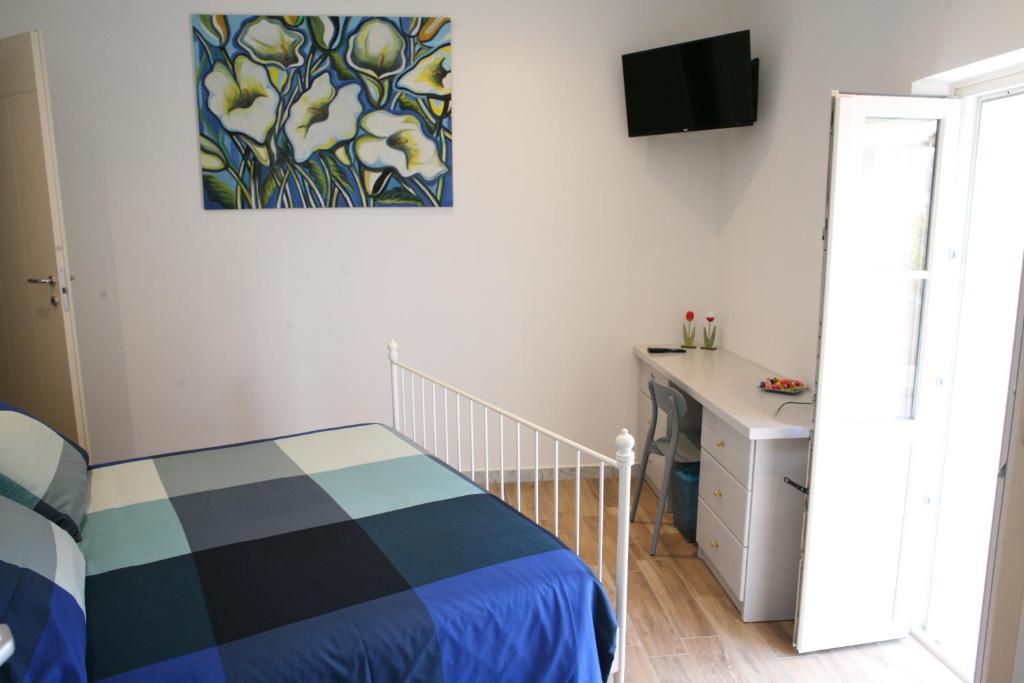 Postel nebo postele na pokoji v ubytování B&B Cà di Bollo