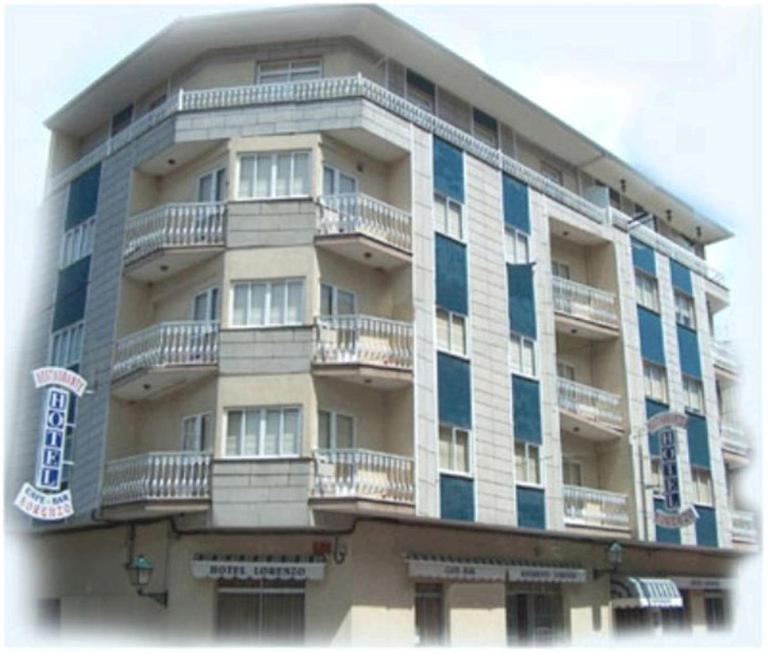 a large building with balconies on the side of it at HOTEL LORENZO in Carballino