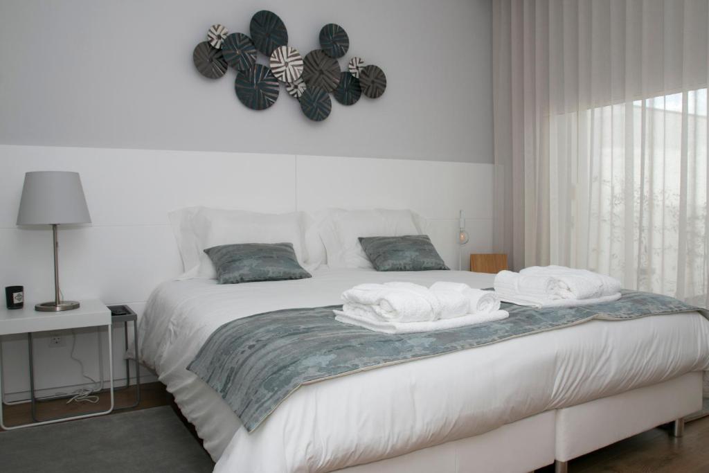 Кровать или кровати в номере Slow House d'Arco