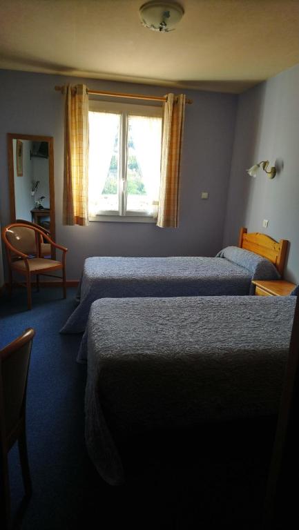 Postel nebo postele na pokoji v ubytování L'Escale de Die