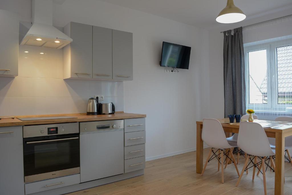 Kuchyňa alebo kuchynka v ubytovaní Apartamenty Asturia