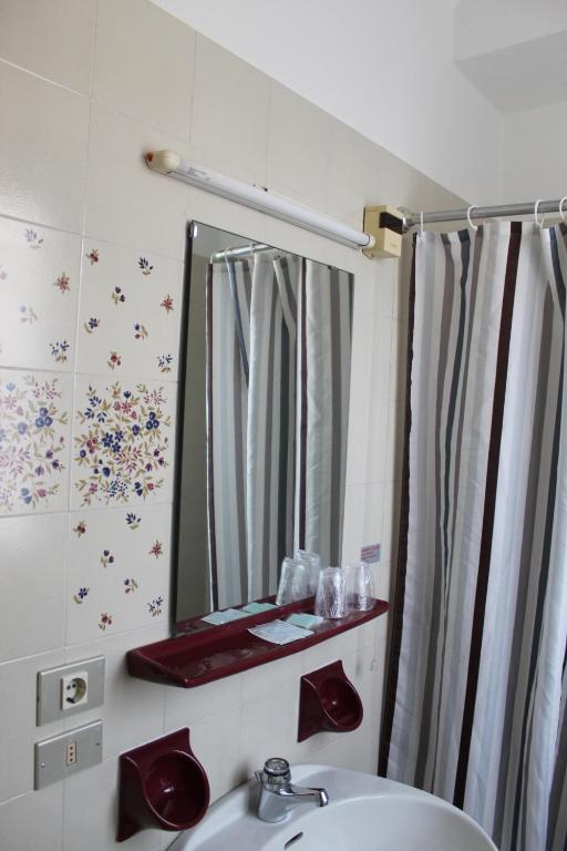 Postel nebo postele na pokoji v ubytování Albergo Tecla