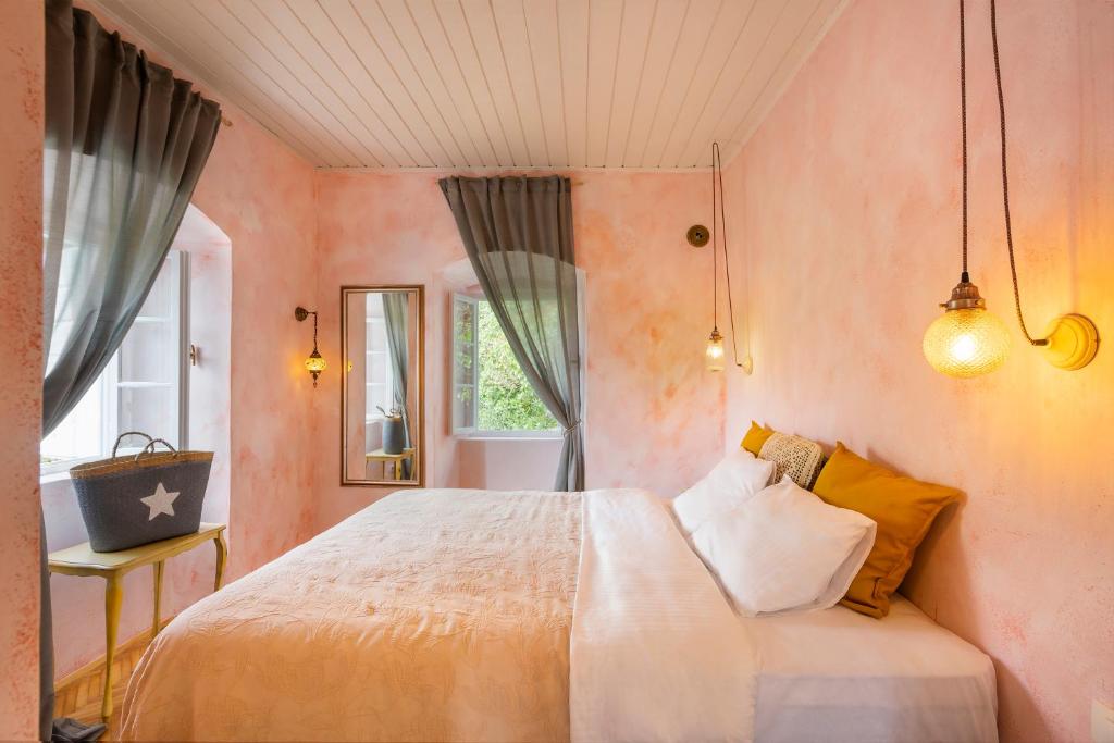 a bedroom with a large bed and a window at Central, Quiet & Romantic Apartment in Herceg-Novi