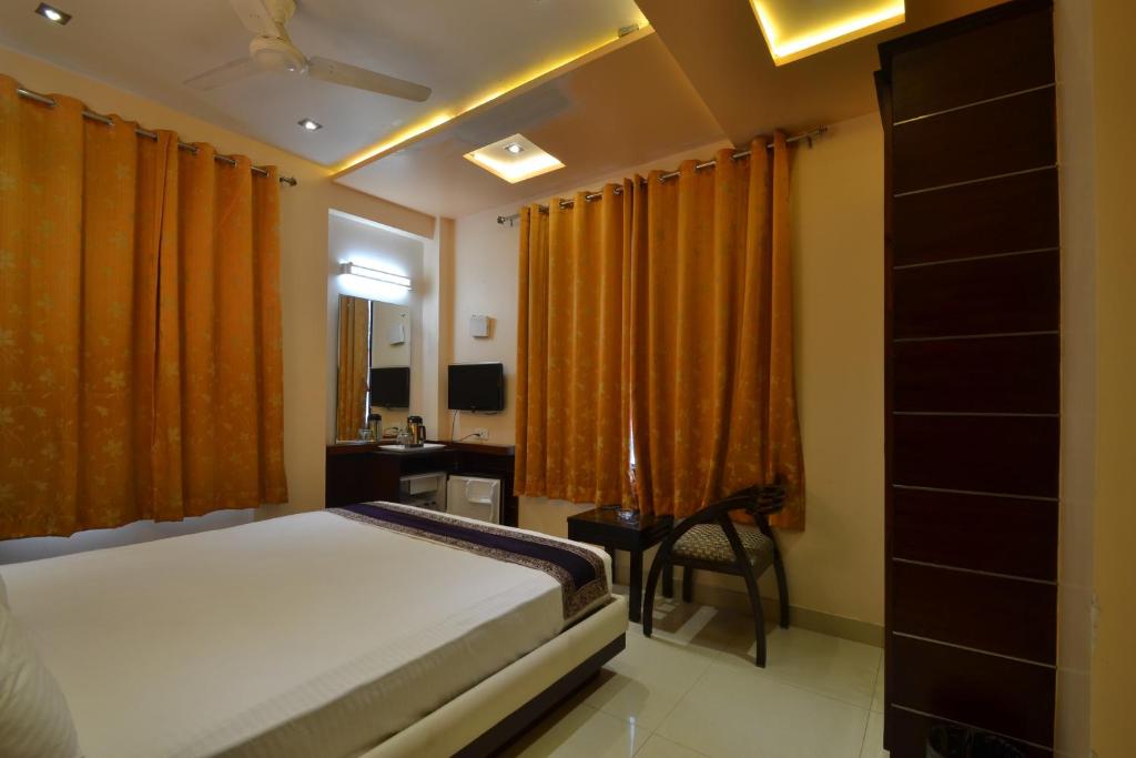 Postel nebo postele na pokoji v ubytování Hotel Central Residency