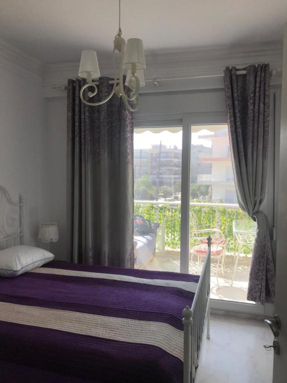 a bedroom with a bed and a large window at Lovely place in Perea in Perea