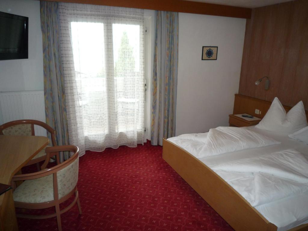 Postel nebo postele na pokoji v ubytování Garni-Hotel Tritscherhof