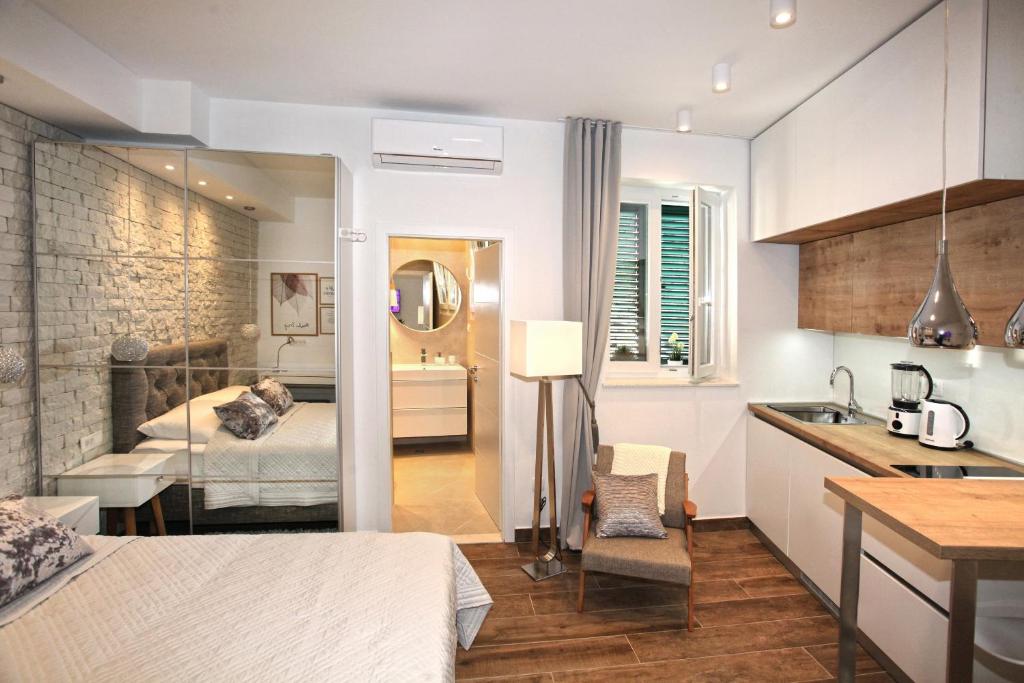 Postel nebo postele na pokoji v ubytování Apartments Tessera