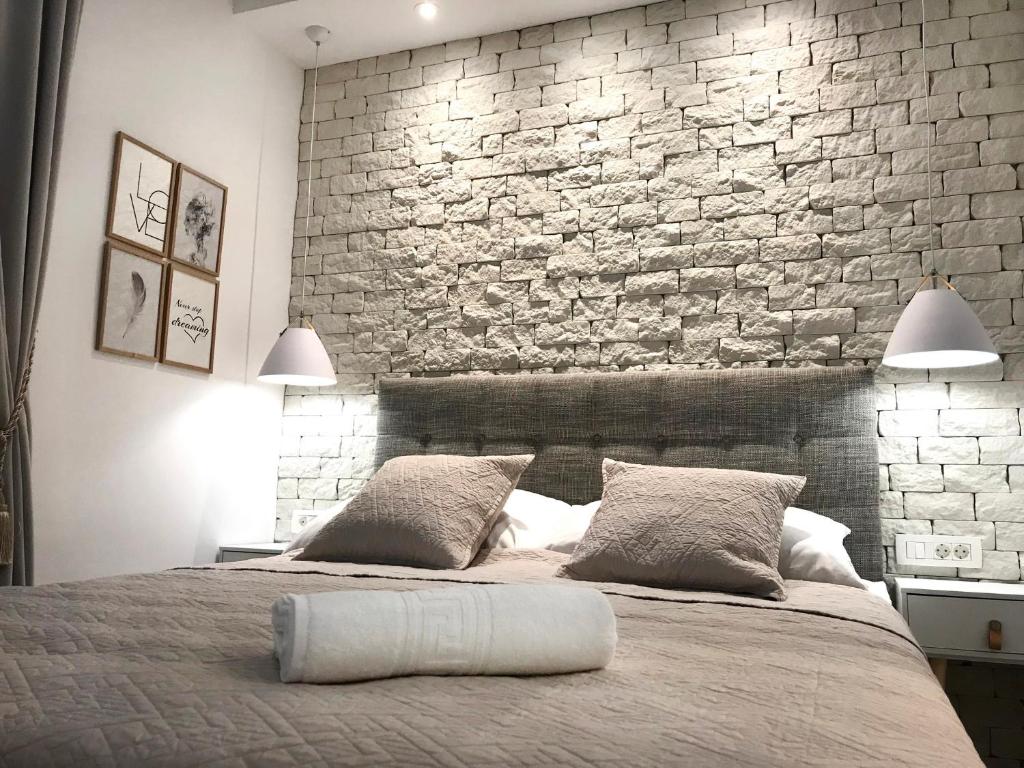 Postel nebo postele na pokoji v ubytování Apartments Tessera