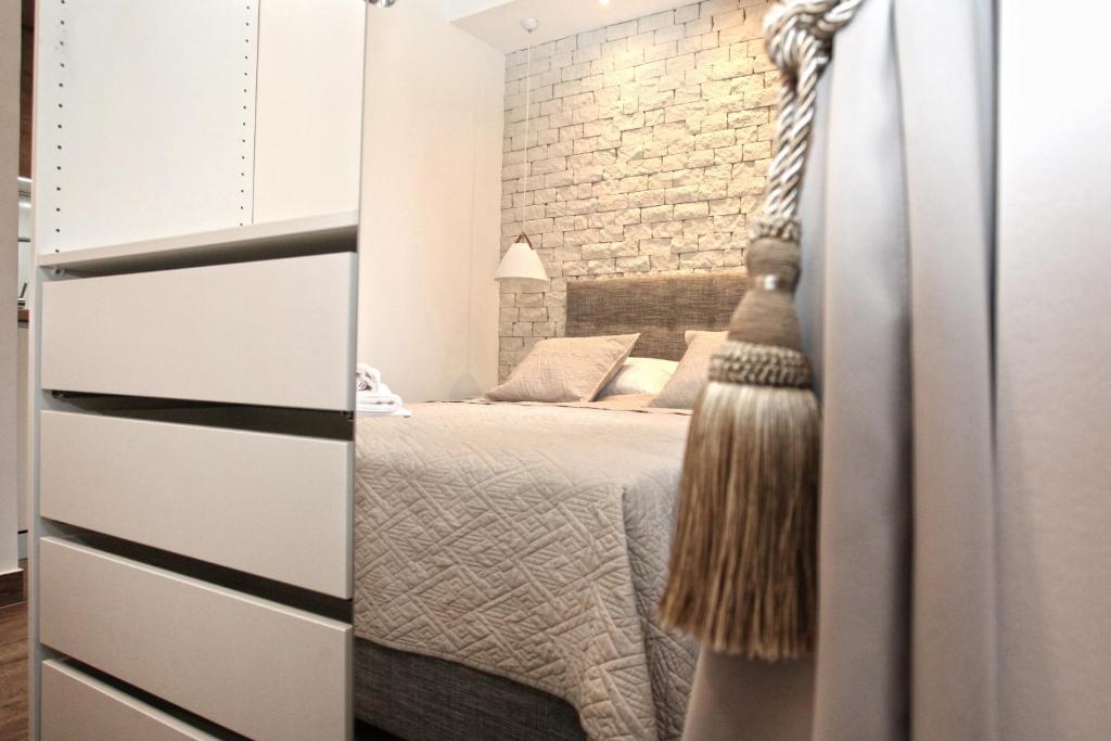 Postel nebo postele na pokoji v ubytování Apartments Tessera