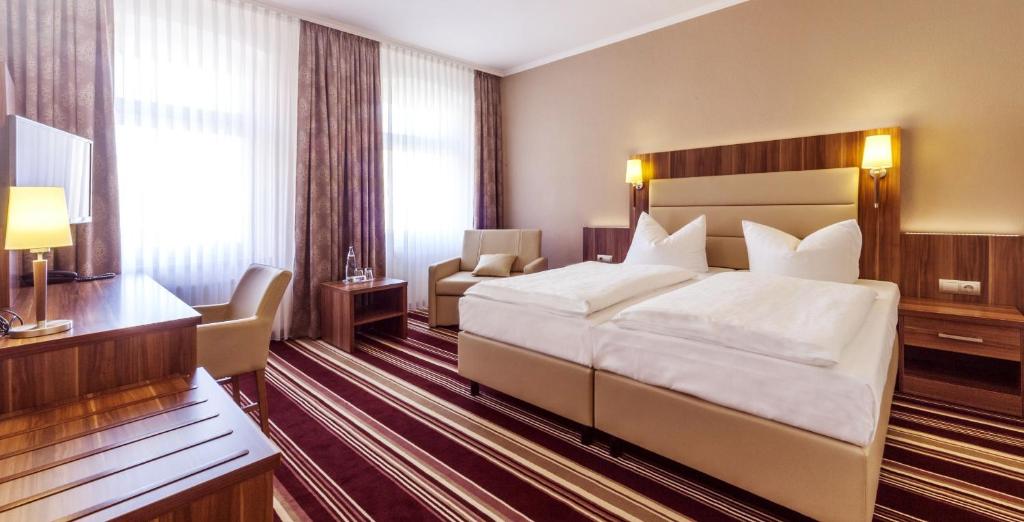 Postel nebo postele na pokoji v ubytování Hotel Burgas