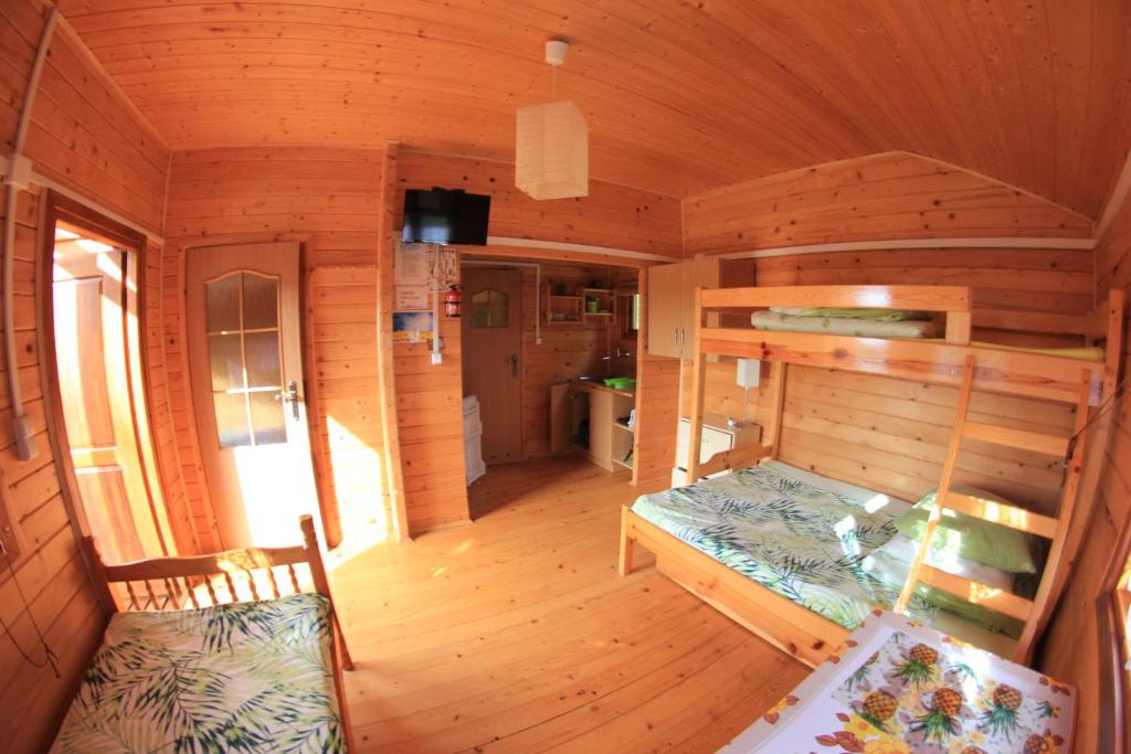 Postel nebo postele na pokoji v ubytování Słoneczna Polana
