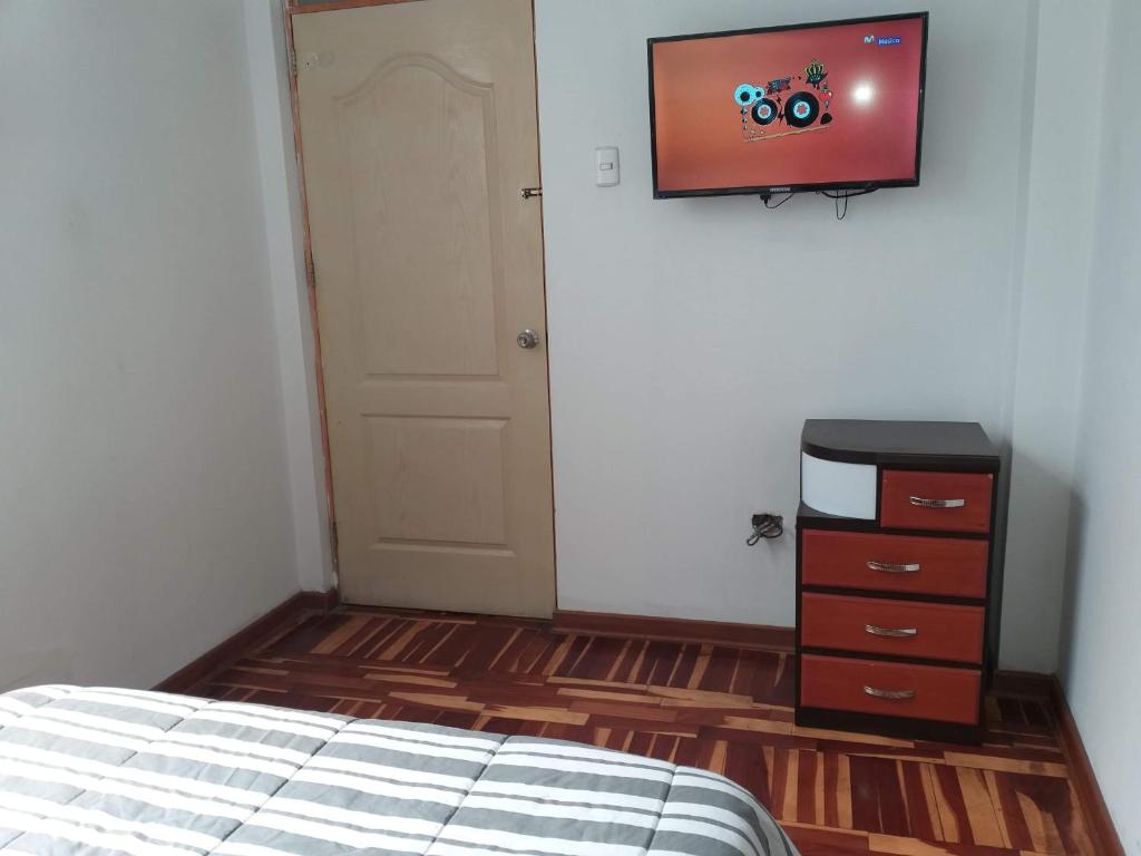 Postel nebo postele na pokoji v ubytování Peruvian Family Hostal Miraflores