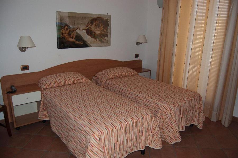 Postel nebo postele na pokoji v ubytování Il Rustico