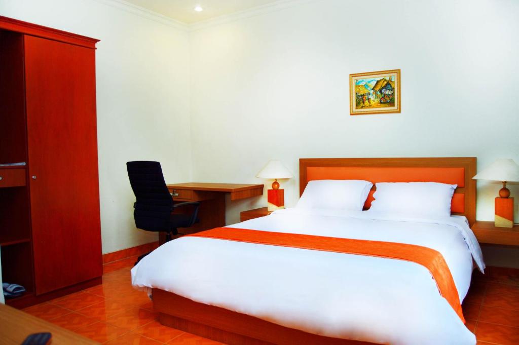 Postel nebo postele na pokoji v ubytování Sanghyang Indah Spa Resort
