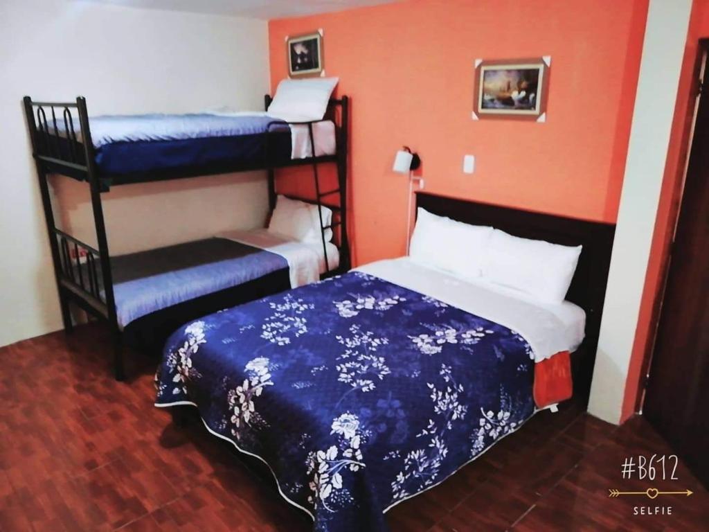 Postel nebo postele na pokoji v ubytování Hostal Mariscal Sucre