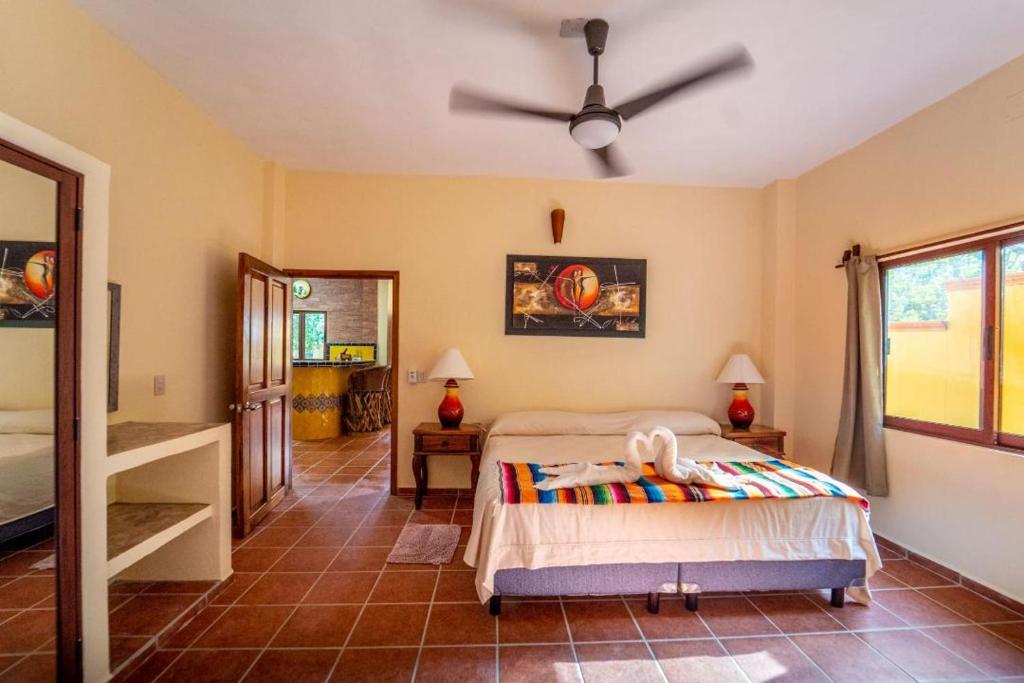Postel nebo postele na pokoji v ubytování Casa palmito cerca de la playa