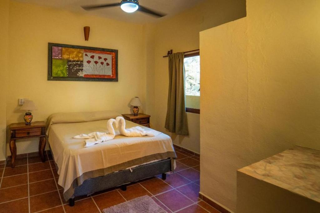 Postel nebo postele na pokoji v ubytování Casa palmito cerca de la playa
