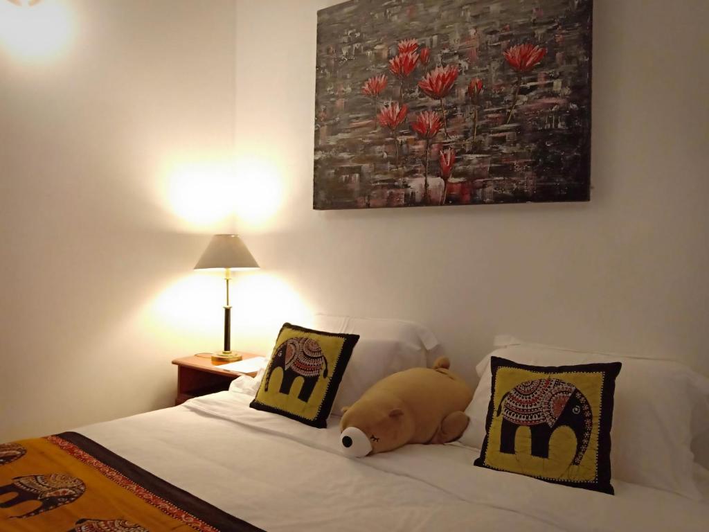 Postel nebo postele na pokoji v ubytování Kaya Residence Kandy