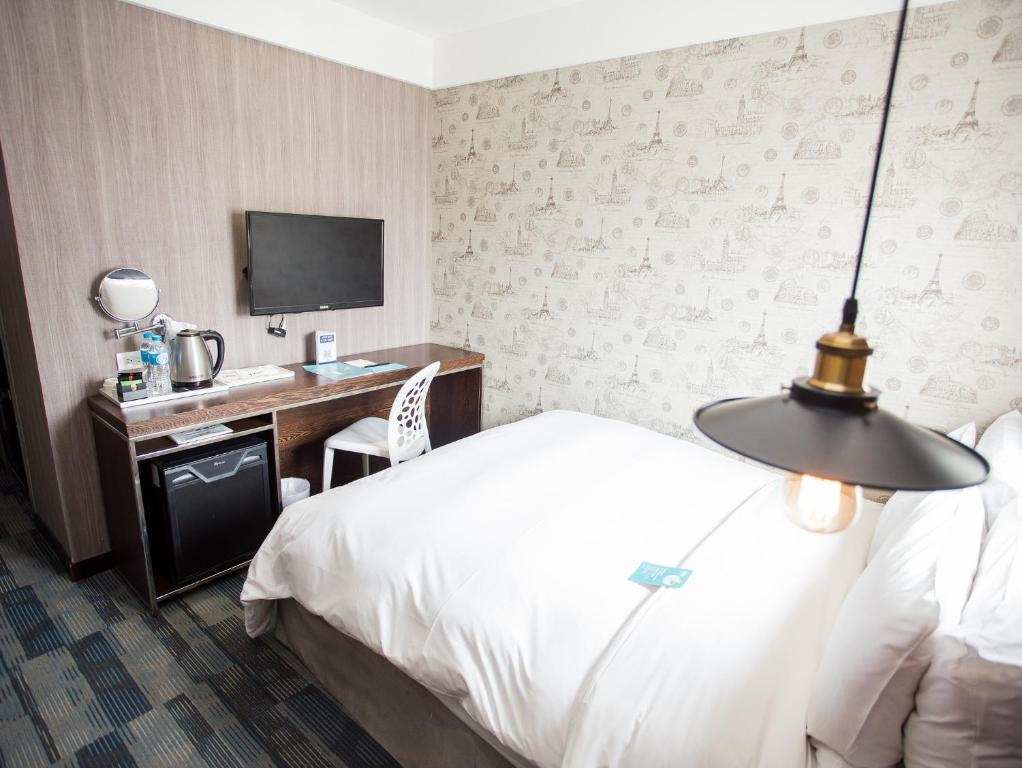 Postel nebo postele na pokoji v ubytování Khan Hotel