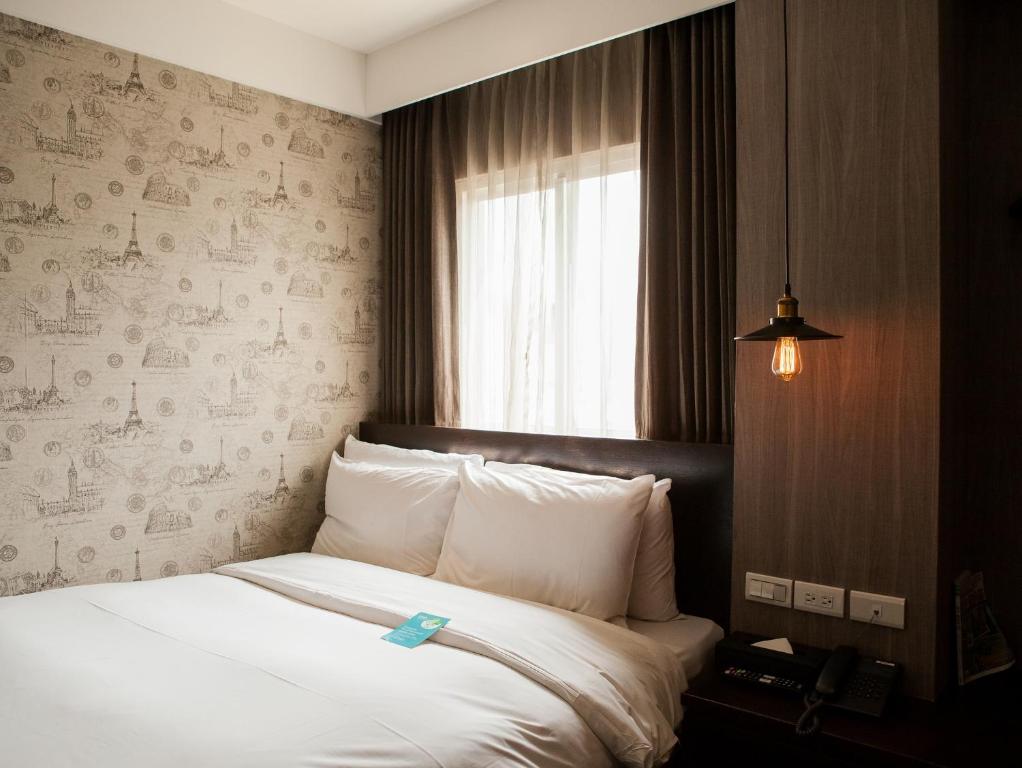 Postel nebo postele na pokoji v ubytování Khan Hotel