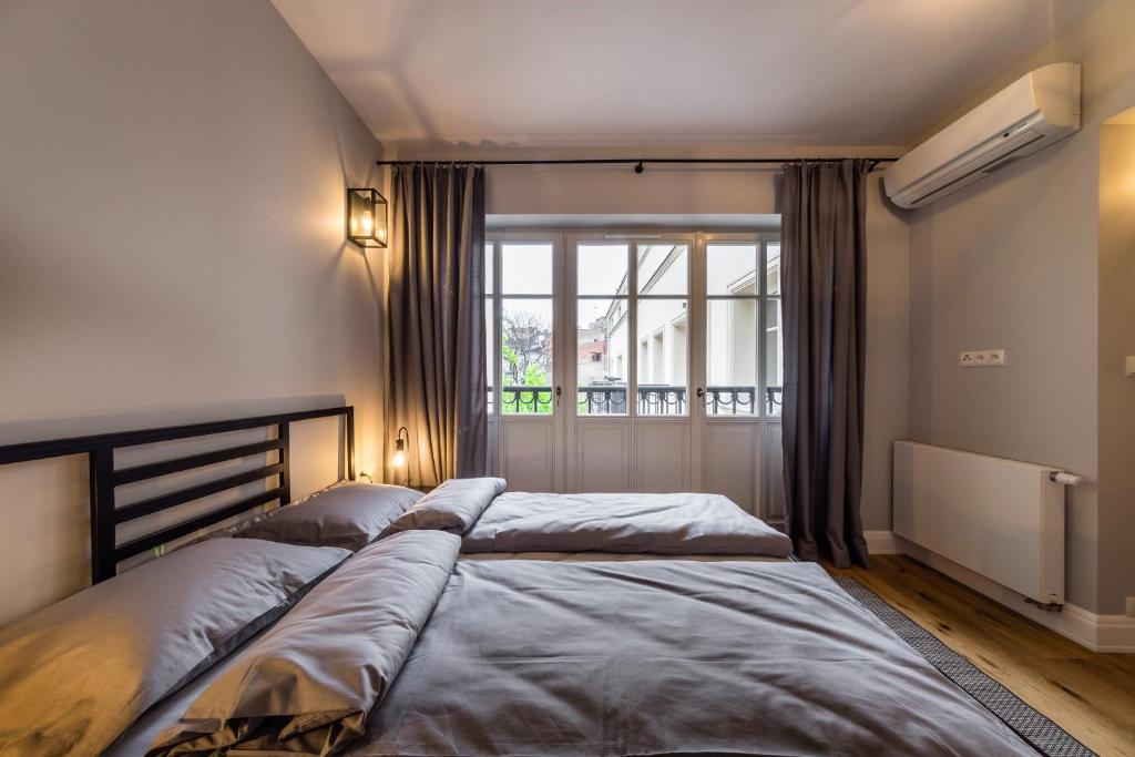 Posteľ alebo postele v izbe v ubytovaní Groble Residence WAWELOFTS
