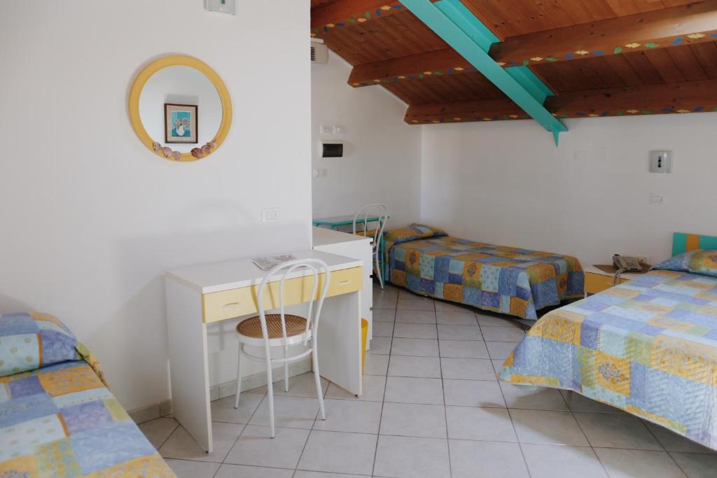 Postel nebo postele na pokoji v ubytování Hotel Marconi