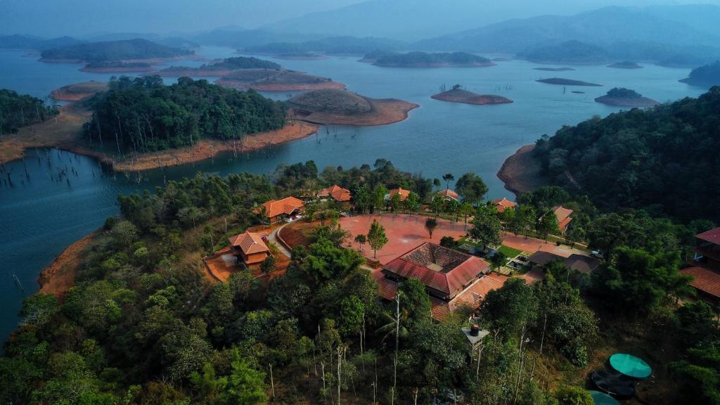 an island in the middle of a body of water at CONTOUR ISLAND RESORT & SPA by CITRINE in Tariyod