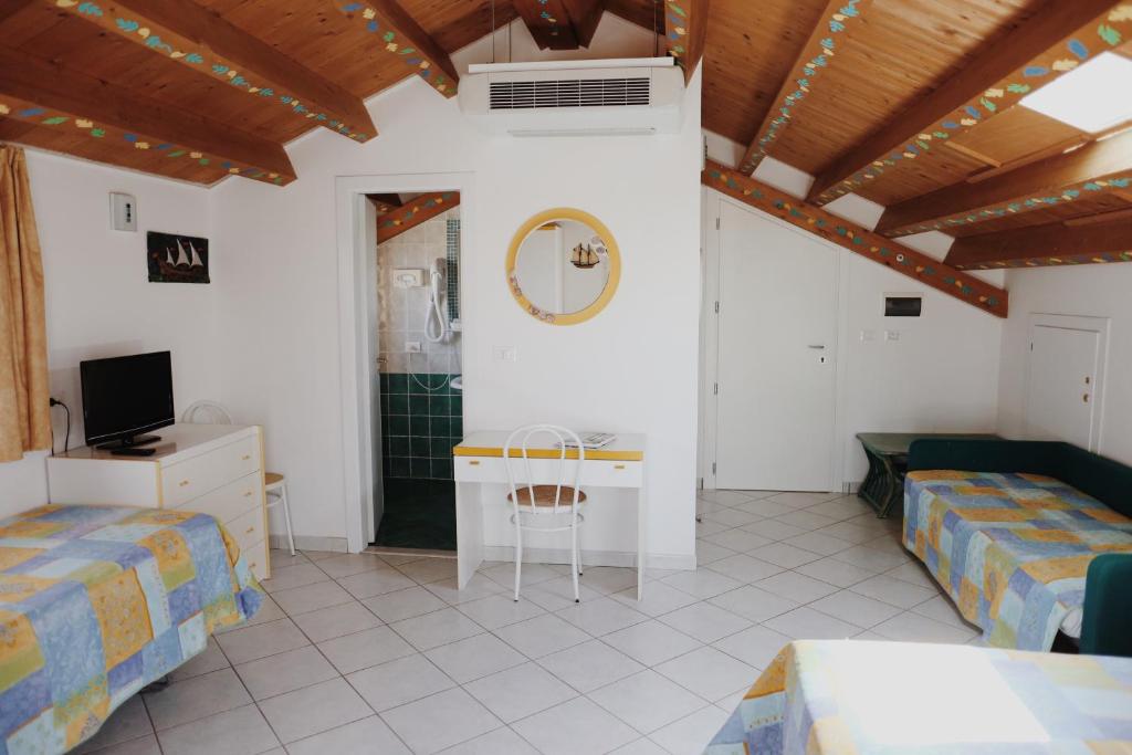 Postel nebo postele na pokoji v ubytování Hotel Marconi
