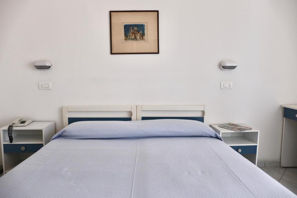 Postel nebo postele na pokoji v ubytování Hotel Marconi