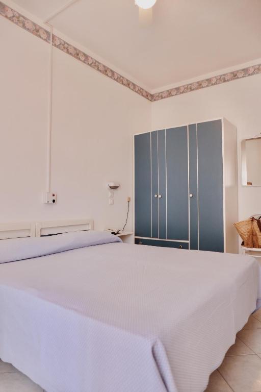 Postel nebo postele na pokoji v ubytování Hotel Marconi