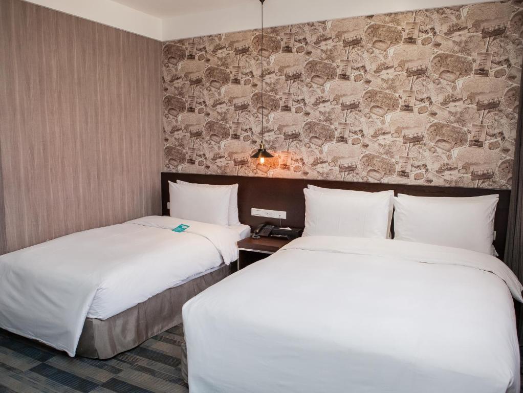 Postel nebo postele na pokoji v ubytování Khan Hotel