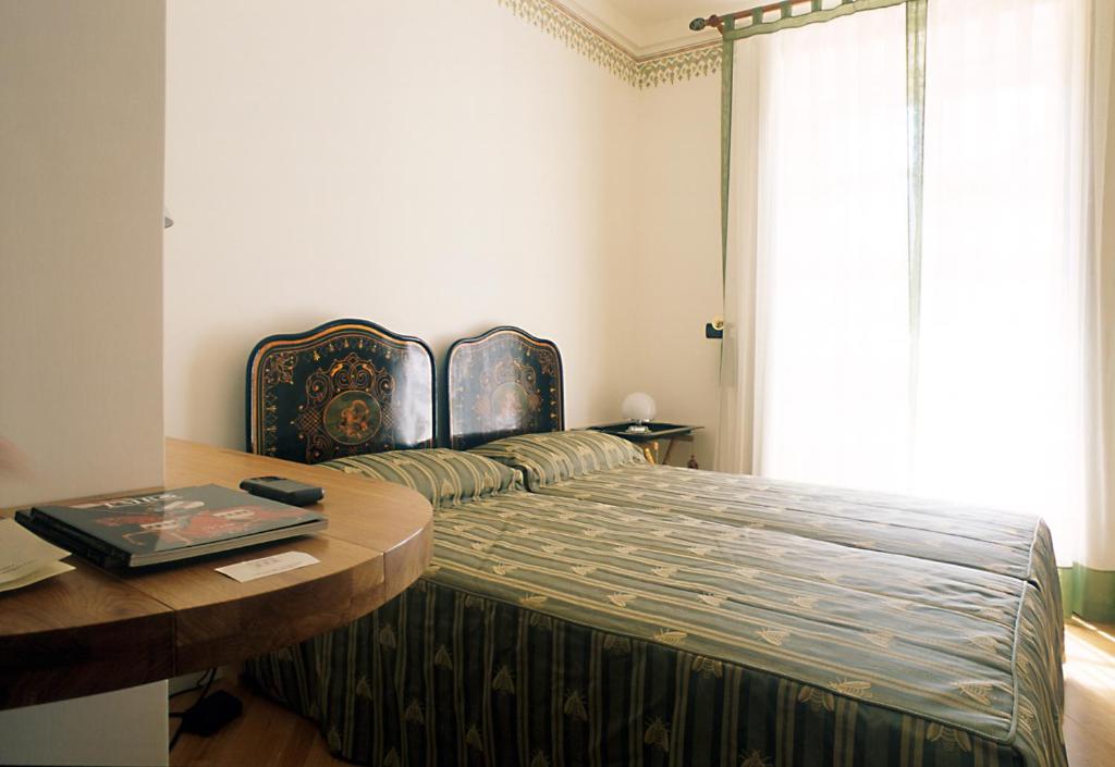 Postel nebo postele na pokoji v ubytování L'Orangerie di Cartia Giovanni