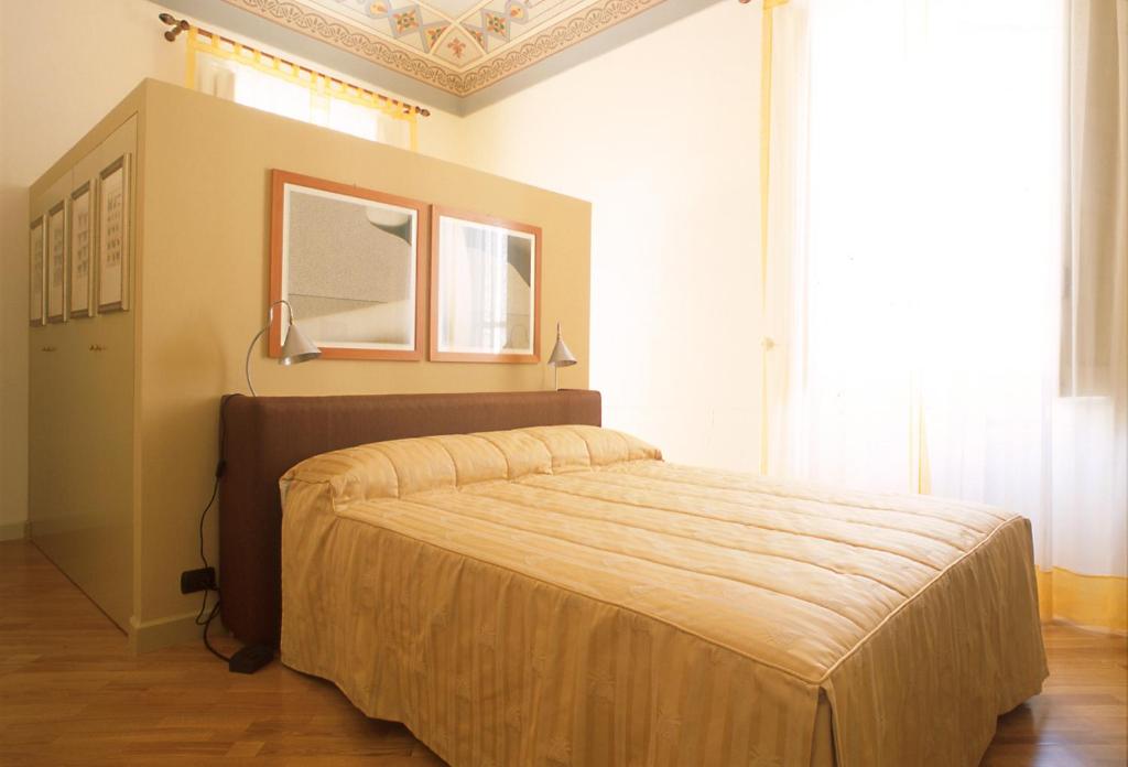 Postel nebo postele na pokoji v ubytování L'Orangerie di Cartia Giovanni