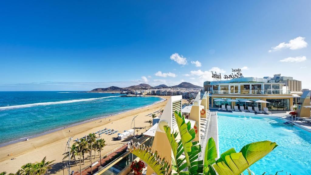a view of a beach with a hotel and the ocean at BULL Reina Isabel & SPA in Las Palmas de Gran Canaria