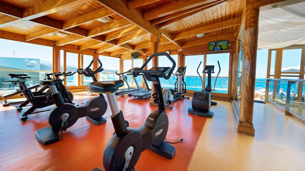 a gym with cardio equipment in a building at Bull Reina Isabel & SPA in Las Palmas de Gran Canaria