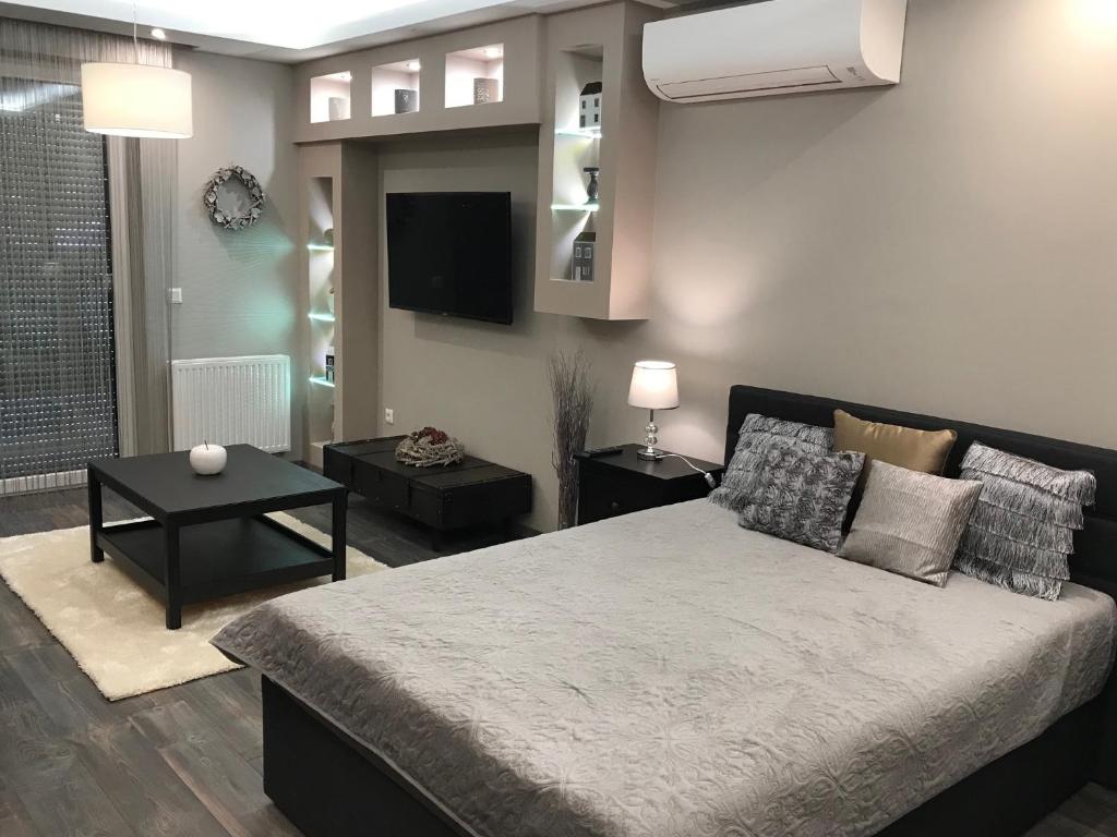 Postel nebo postele na pokoji v ubytování Orient Suite
