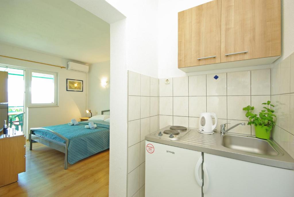 Un ou plusieurs lits dans un hébergement de l'établissement Apartmani Maslina