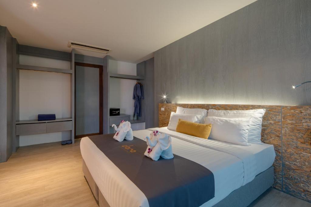 Postel nebo postele na pokoji v ubytování DARA Hotel - SHA Plus
