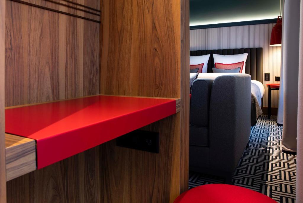 Postel nebo postele na pokoji v ubytování Hotel D Geneva