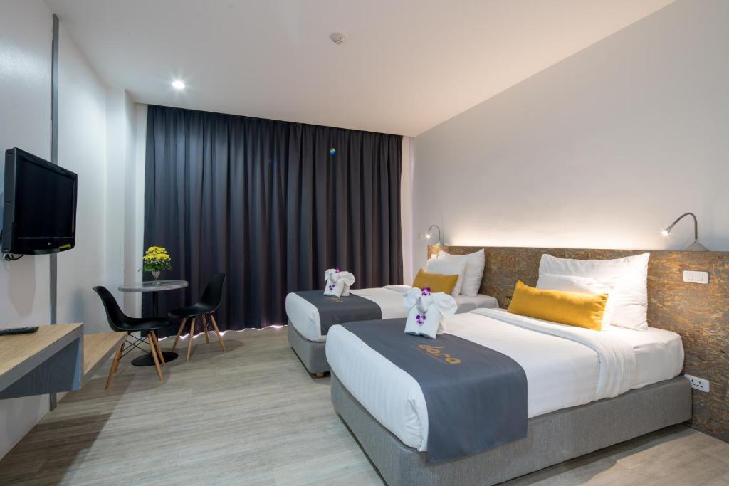 Postel nebo postele na pokoji v ubytování DARA Hotel - SHA Plus