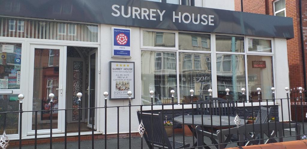 a sunergy house with a table and chairs outside of it at Surrey House Hotel in Blackpool