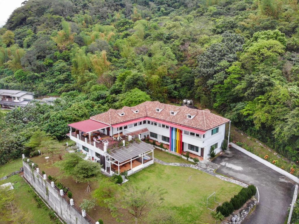an overhead view of a large house with a roof at Li Wu Zuo Cun B&amp;B in Chongde