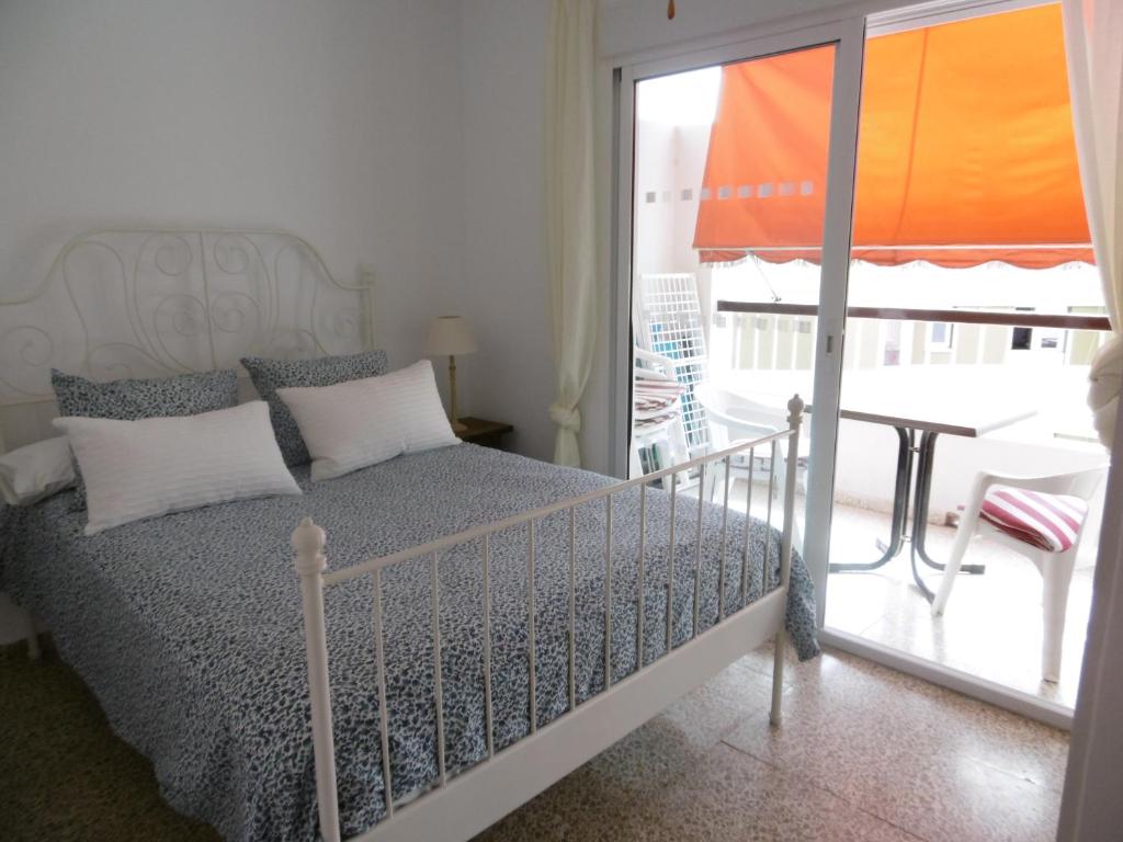 Postel nebo postele na pokoji v ubytování Apartamento Neptuno