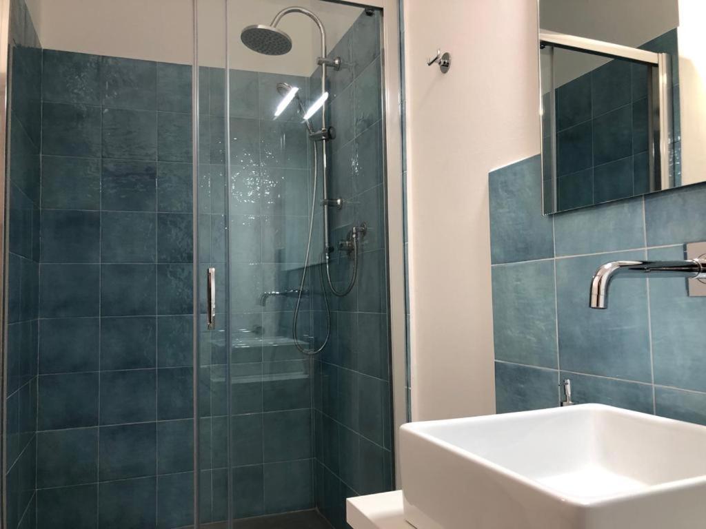 a bathroom with a shower and a sink at Bilocale Milù in La Maddalena